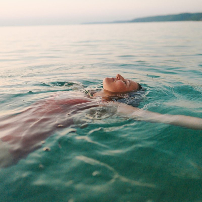 a woman back-floating in the sea