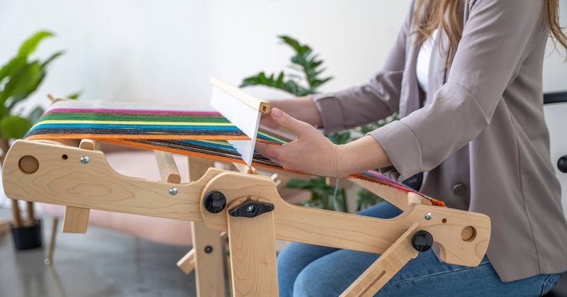 Weaving on a Schacht Flip rigid heddle loom (Source: Schacht Spindle Company)