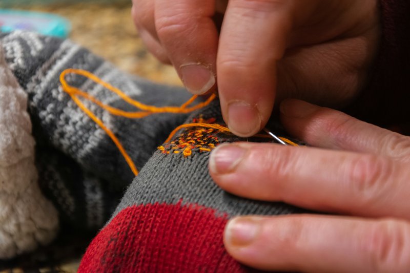 Repairing a knitted garment (Photographer: Joseph Sharp)