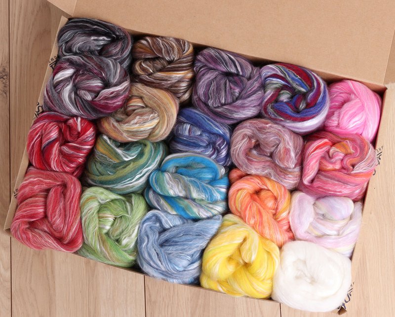 A box of variegated wools (Source: Ashford Wheels and Looms)