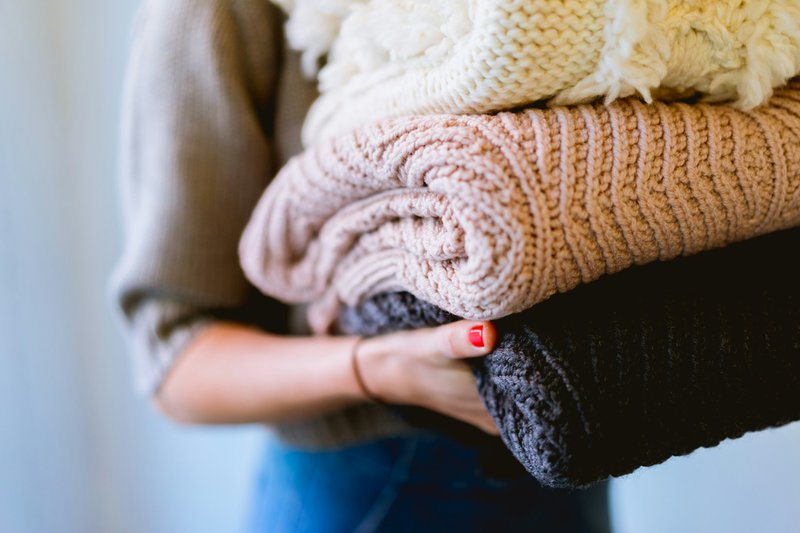 Carrying thick knitted garments (Photographer: Dan Gold)