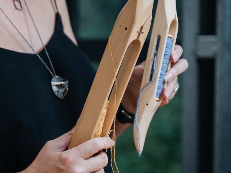 Weaving shuttles with bobbins (Source: Thread Collective)