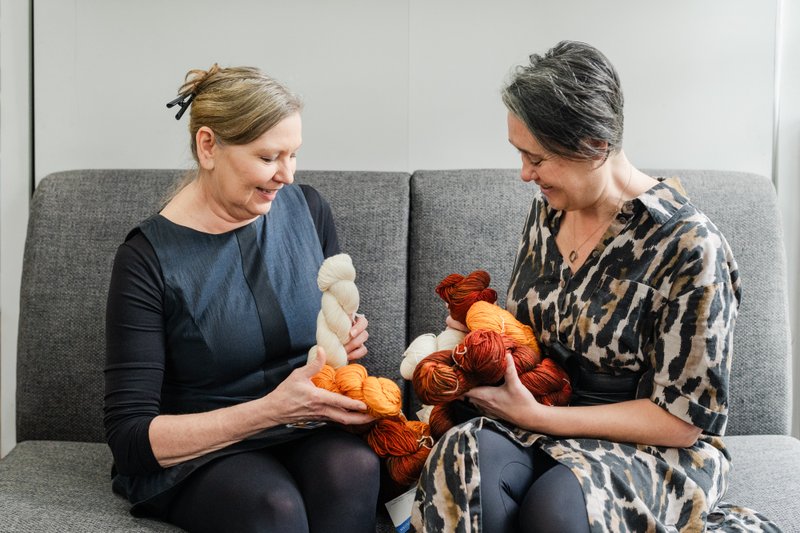 Naomi and Nicky of Thread Collective holding skeins of Malabrigo yarn (Photographer: Samantha Gehrmann)
