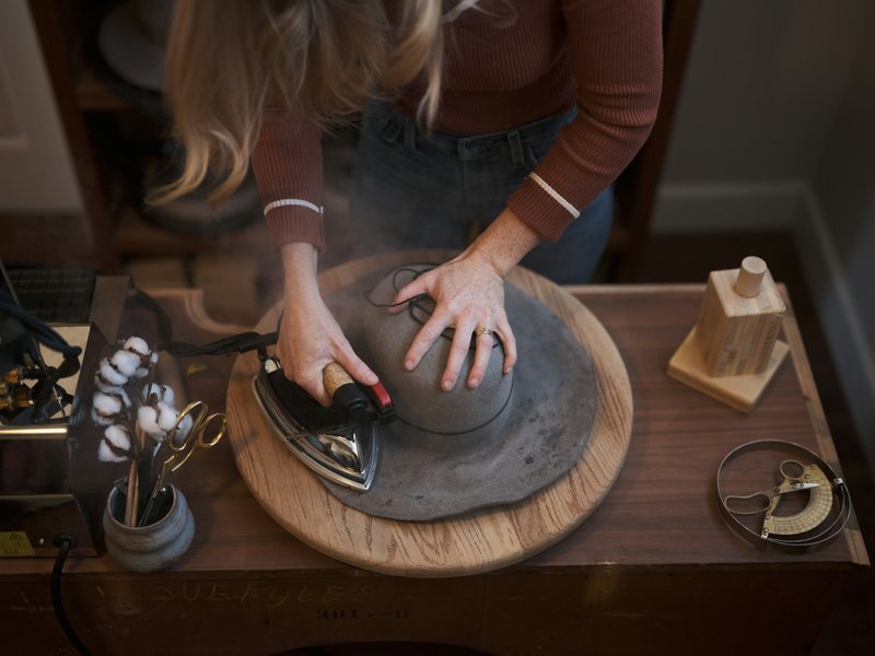 Shaping a newly felted hat (Photographer: Joel Timothy)