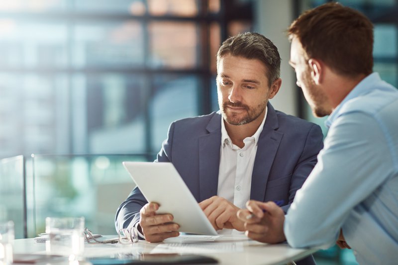 salespeople reviewing metrics