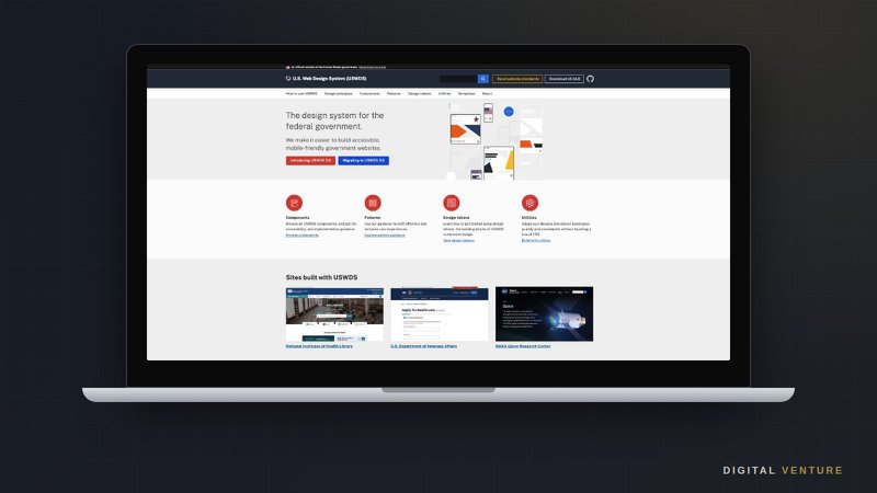 Laptop displaying the U.S. Web Design System homepage, the federal design system for accessible, mobile-friendly websites