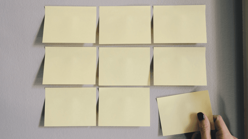 Ideas waiting to be grouped with yellow sticky notes.