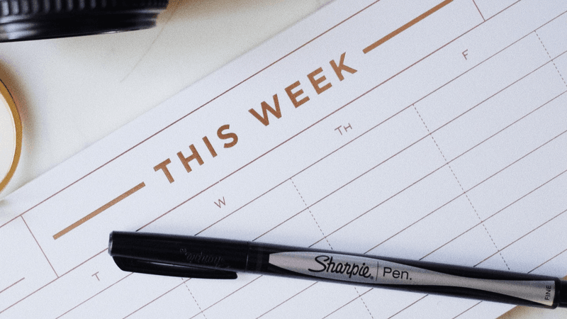 Time Blocking: Desk calendar labeled "This Week" with a black sharpie.