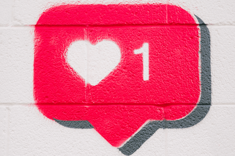 A red chat bubble depicting a like. 