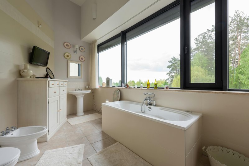 Bathroom interior with a newly reglazed bathtub.