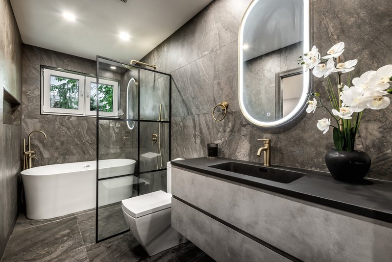 Modern bathroom design with stone-look panels.