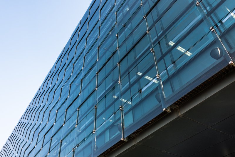 Building with custom tempered glass windows
