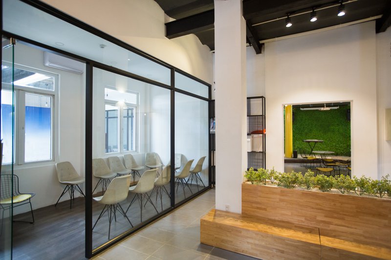 Tempered glass door that leads to a waiting room.