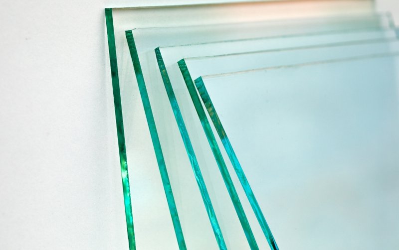 A pile of tempered glass sheets