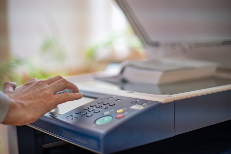 a photocopier-printer being used.