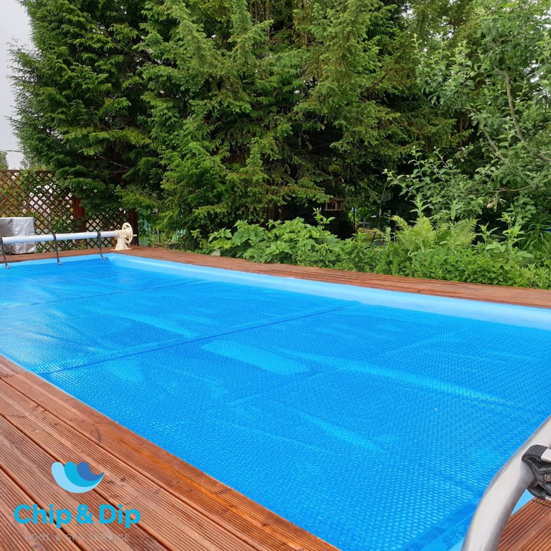 A fiberglass plunge pool with WPC panel flooring.