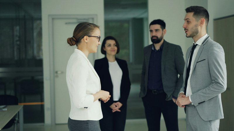 a woman being introduced. referral marketing for financial advisors