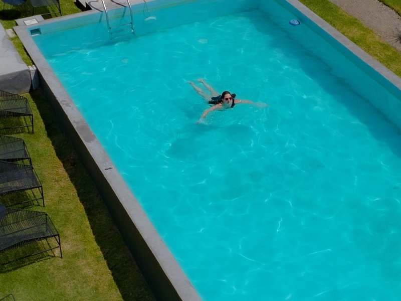 An above-ground fiberglass pool.