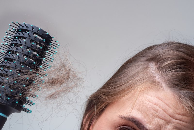 someone in need of low-level laser therapy hair loss