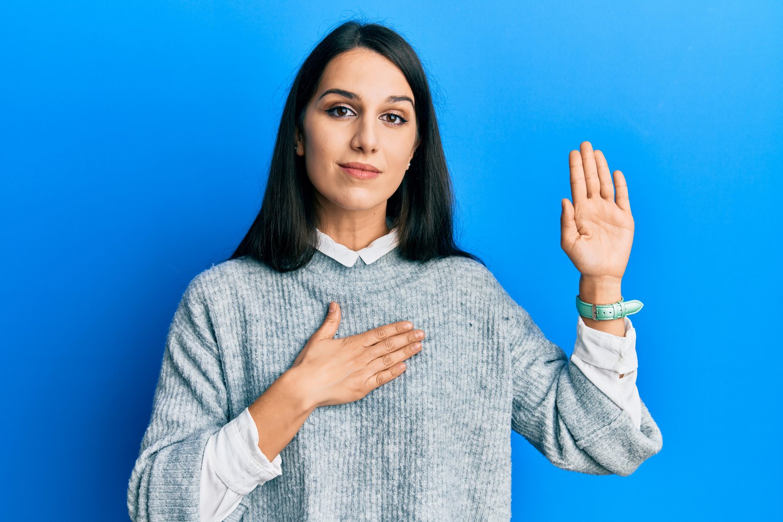What is a certificate of Naturalization? A young woman pledges her allegiance as a part of the process.