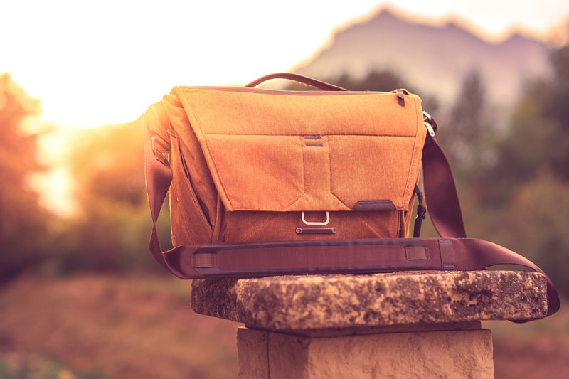 a suitcase on a stack of rocks