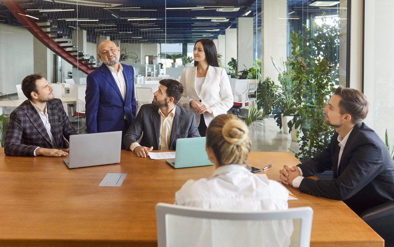 Executive team reviewing revenue share model for associations
