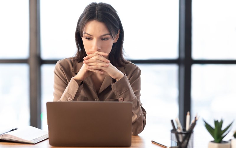 Employee reviewing ways on how to increase association sponsorship revenue
