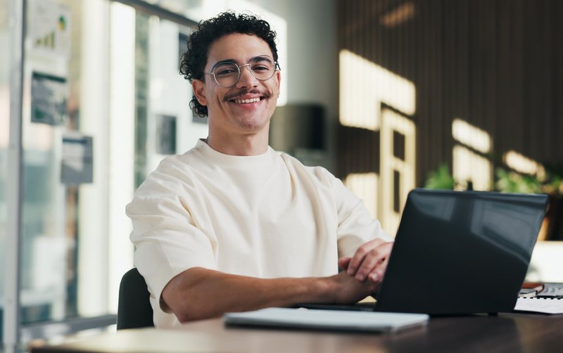 Website designer smiling at camera