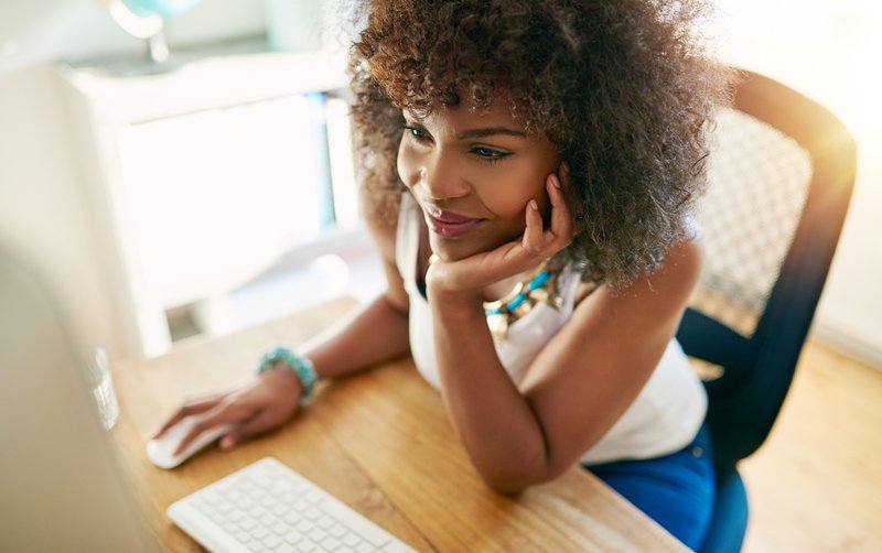 Employee working on association media channels.