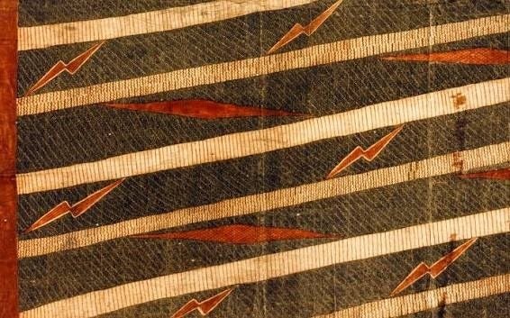 Traditional Hawaiian kapa cloth with red and cream geometric patterns from the Kealapiko archive