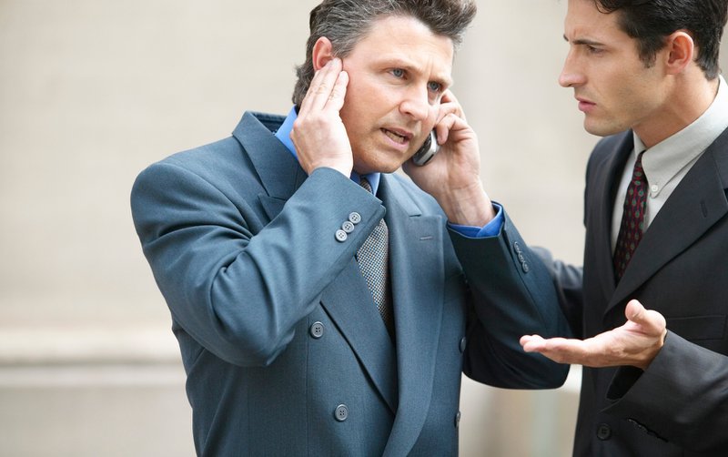 Businessman dealing with trademark issues.