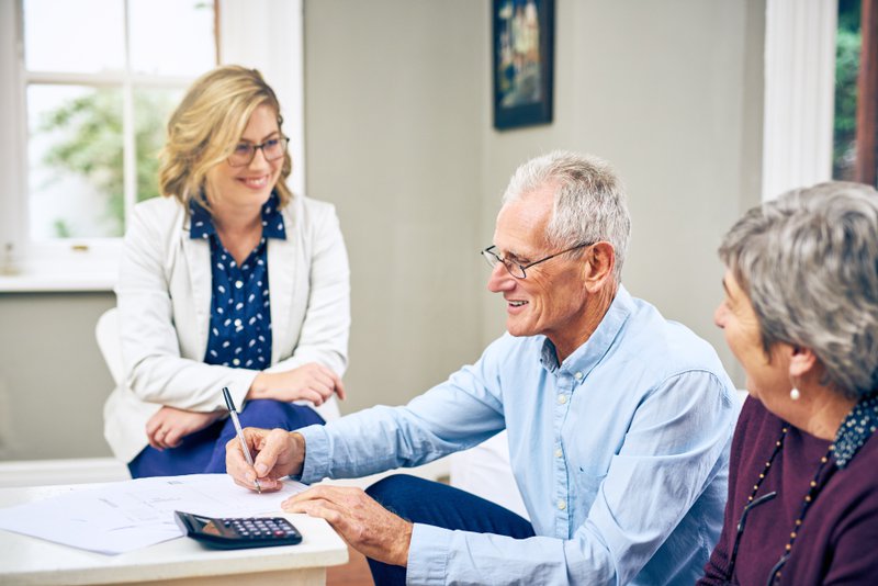 A financial discussion between two people and an advisor