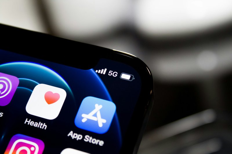 A phone with an App Store icon; the place where many apps are first released to market.