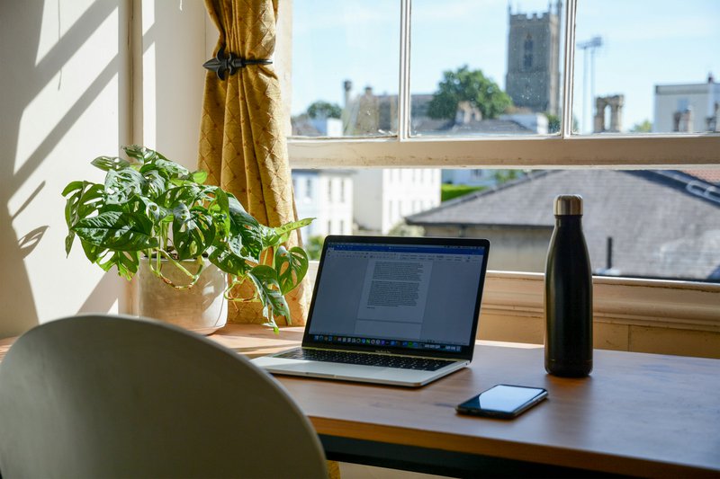 Clean, peaceful home office space highlighting a key benefit of remote work.