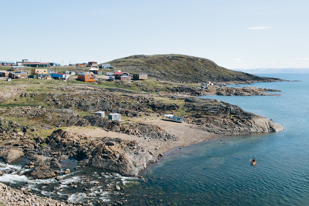 Louis-Philip Pothier, owner/operator, and lead guide of Inukpak Outfitting, paddles his kayak in the inlet of Frobisher Bay near the small community of Apex, Nunavut, Canada. July 2, 2017.
