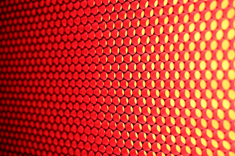 a close up of a red and yellow background