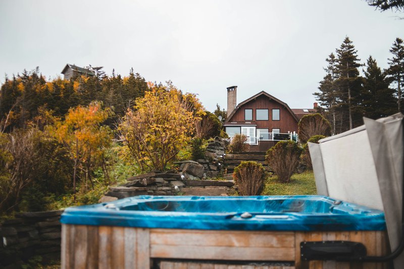 a hot tub sitting in front of a house