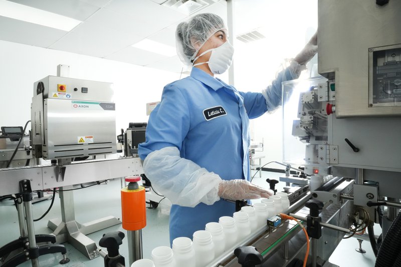 Bactolac employee checking the quality of supplement brands