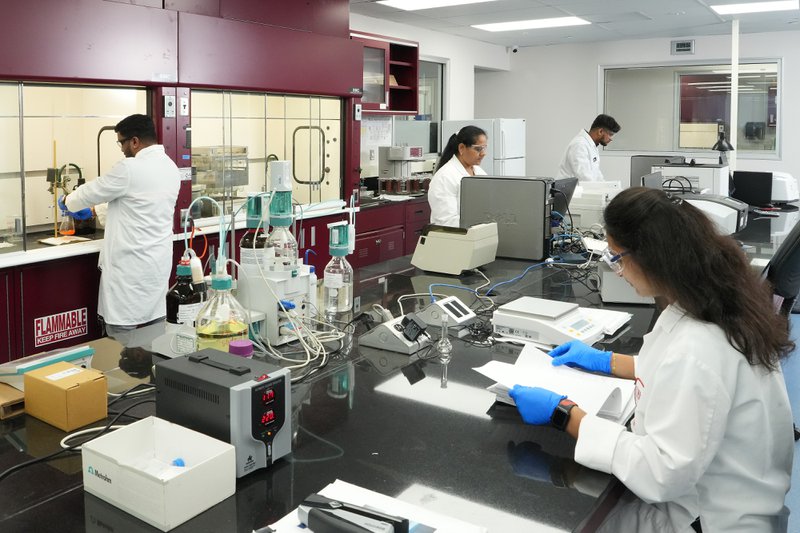 Scientist developing custom formulas for a supplement brand
