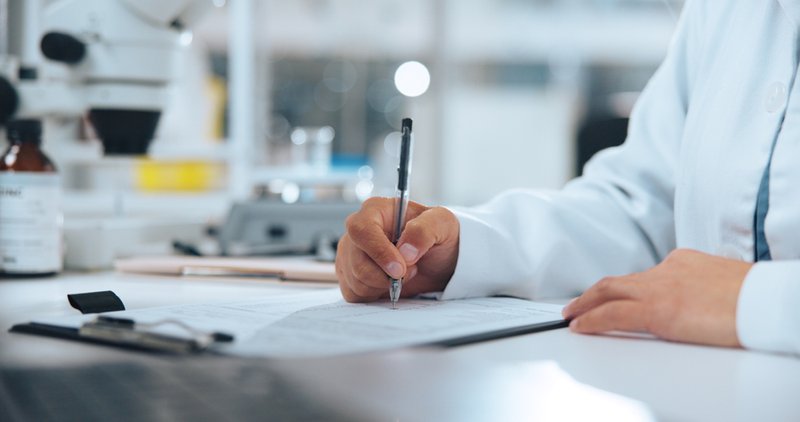 Scientist documenting reliable manufacturing SOPs