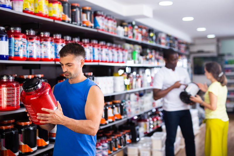 Man checking out powder-based supplement's shelf life.