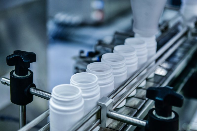 Supplement bottles on conveyor belts