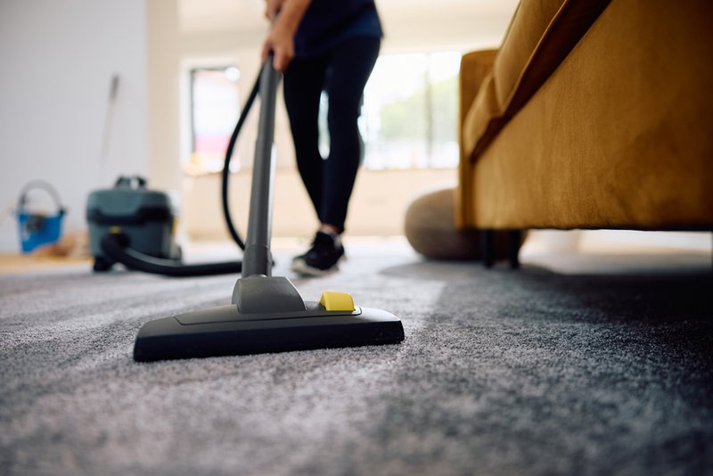A cleaning service Five Star Maids, vacuums the living room area removing pollutants from carpets and furniture and catch almost all allergens.