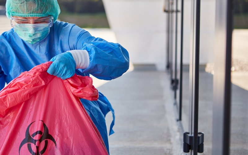 Emergency cleaning crew in a biohazard suit.