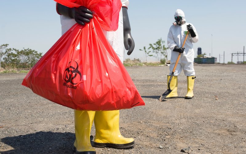 Cleaning crew performing an industrial accident cleanup.