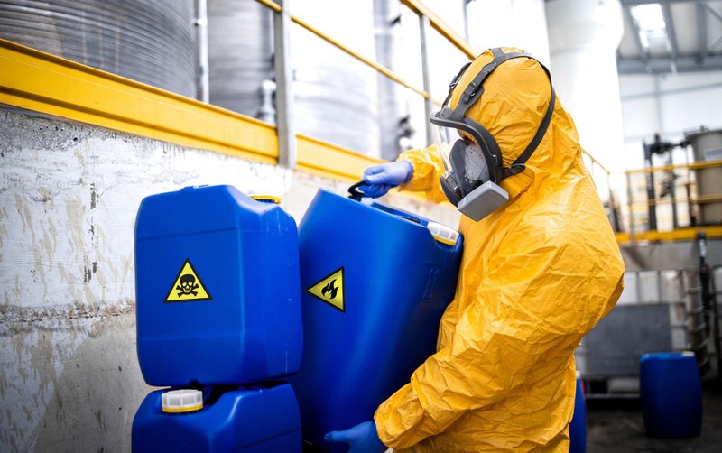 Containers marked as hazardous material disposal.