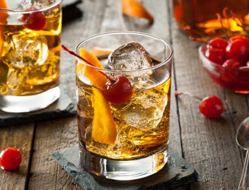 a sweet cozy looking drink with cherries