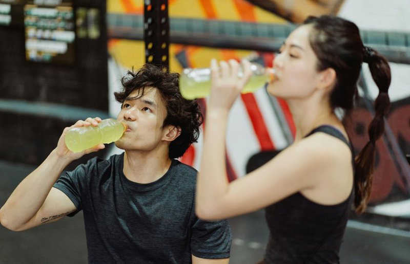 People drinking flavored hydration energy drinks