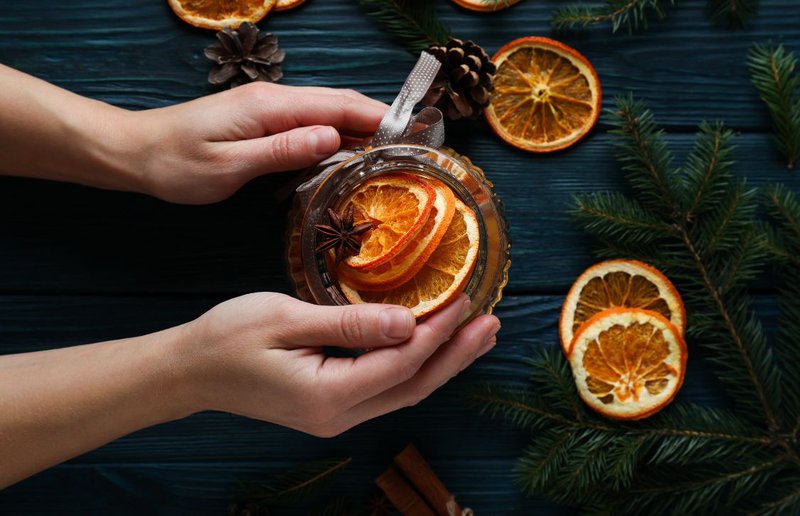citrus drinks being prepared in a cup