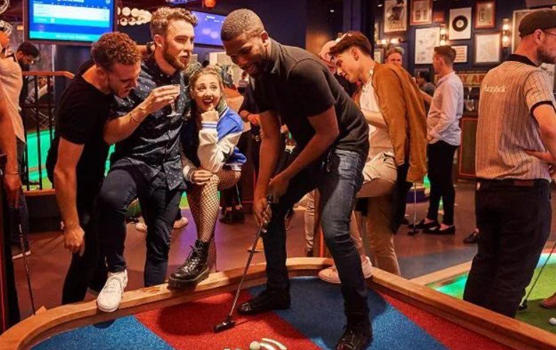 Community sports night at an indoor mini golf league